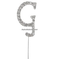 Tårtdekoration med diamanter bokstaven G