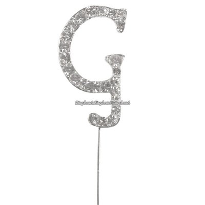 Tårtdekoration med diamanter bokstaven G